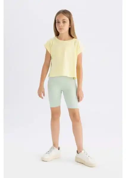 DeFacto Kız Çocuk Giyim Ürünleri Karşılaştırması: Biker Tayt ve Desenli Şort Özellikleri